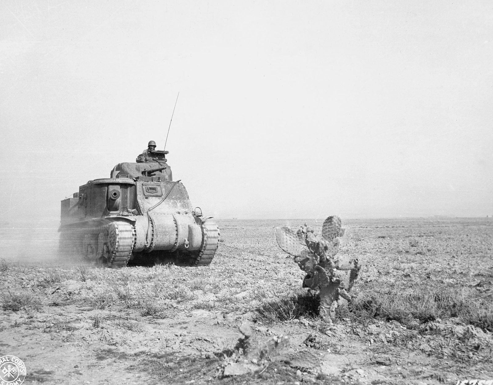 A U.S. Army M3 Grant tank of the 1st Armored Division advancing to support American forces during the fighting at Kasserine Pass, Tunisia, in 1943