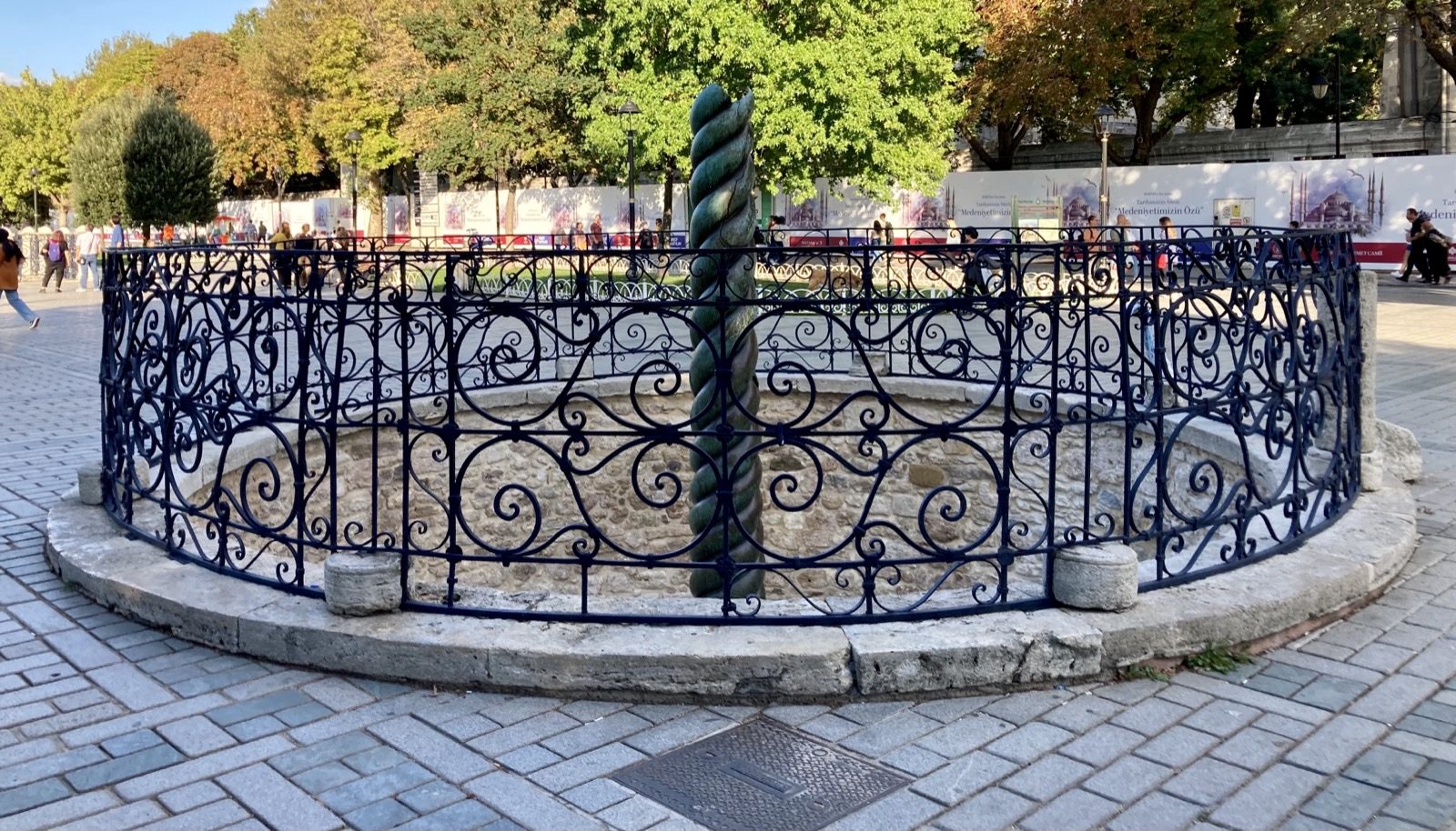 The bronze Serpent Column, its three intertwined snake bodies visible but missing their heads, standing in Istanbul's Sultanahmet Square