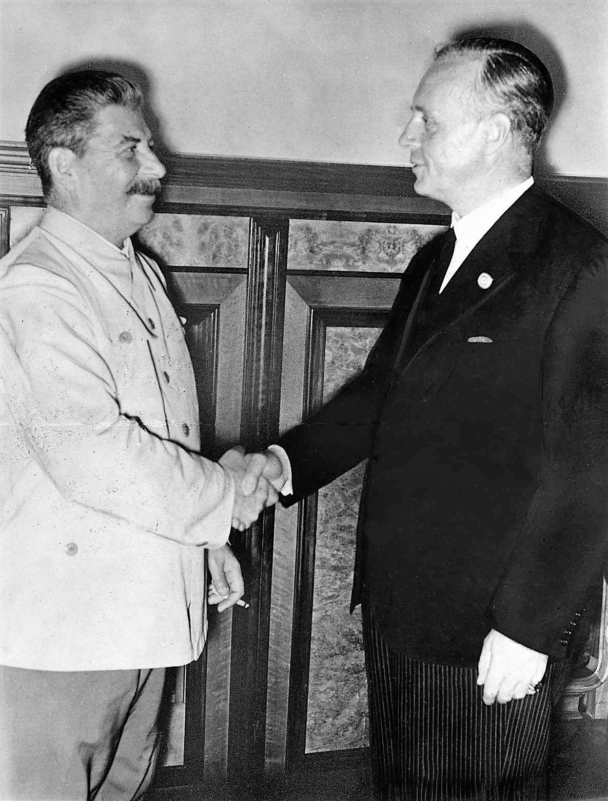 Joseph Stalin shaking hands with German Foreign Minister Joachim von Ribbentrop in the Kremlin after the signing of the Molotov-Ribbentrop Pact, Moscow, 23 August 1939