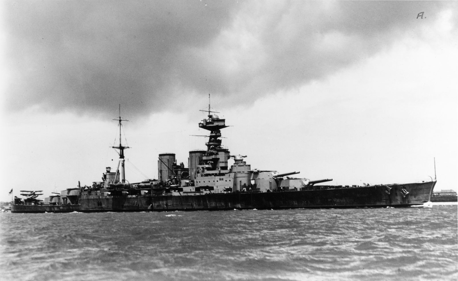 The British battlecruiser HMS Hood underway at sea in 1931, fitted with an aircraft catapult on her aft deck