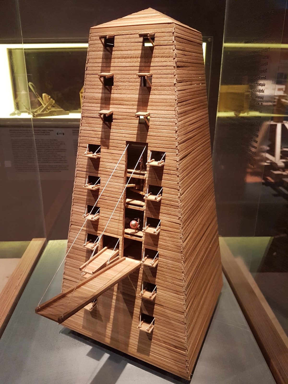 A modern museum reconstruction model of the Helepolis siege tower on display at the Kotsanas Museum of Ancient Greek Technology in Thessaloniki